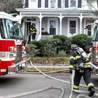 <p>Ridgewood firefighters quickly got water on the flames at 19 Liberty Street on Monday, Dec. 11.</p>