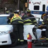 <p>Ridgewood firefighters free the trapped Toyota Camry driver following an afternoon crash.</p>