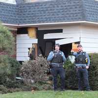 <p>The Acura SUV plowed right through the back of the garage on Van Dien Avenue in Ridgewood.</p>