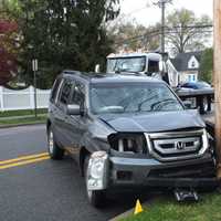 <p>The SUV hit a parked car and then the pole on Harristown Road in Glen Rock.</p>