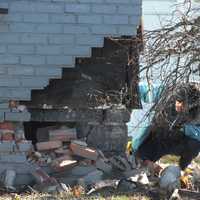 <p>Fair Lawn building inspector surveys the damage at 12-11 20th Street on Sunday, Jan. 15.</p>