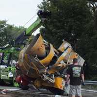 <p>Citywide Towing righted and removed the cement mixer.</p>