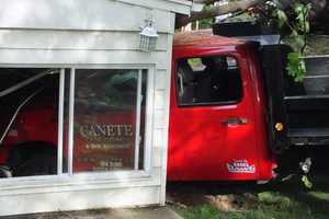 Dump Truck With Trailer Barrels Down Embankment Into Hawthorne Home