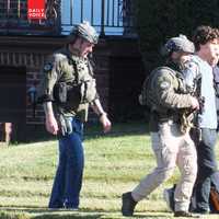 <p>Jason Vicari is led from the home following the killing of his grandfather, Ronald Vicari, 81.</p>