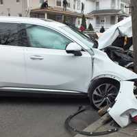 <p>Airbags deployed when the Buick Enclave hit the hydrant and pole in Ridgewood in front of an audience of roofers.</p>