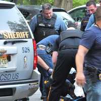 <p>Rescuers tend to the victim at Saddle River County Park in Paramus.</p>