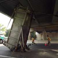 Vertical Hold: Dump Truck Trailer Gets Wedged Under Route 17 Overpass In Mahwah