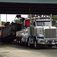 <p>Two heavy-duty wreckers were needed to get the trailer out of there.</p>