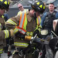 <p>Firefighters with the Fair Lawn Heavy Rescue squad free the injured driver.</p>