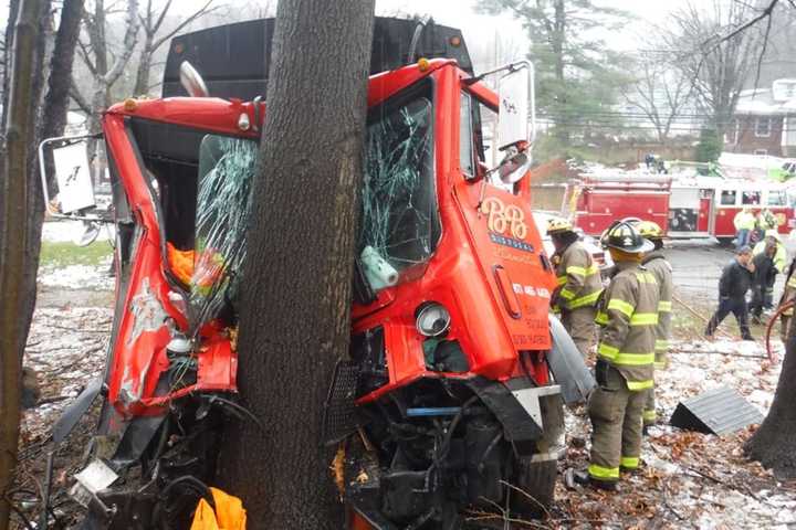 PHOTOS: Garbage Truck Slams Into Tree, Hawthorne Officer Rescues Driver