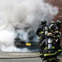 <p>Ridgewood firefighters doused the smoky downtown van blaze on Monday, April 24.</p>