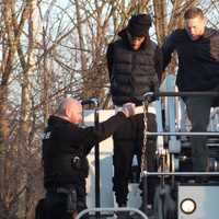 <p>Paramus police remove handcuffed suspect from roof.</p>