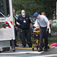 <p>One of the pedestrians struck in Wyckoff is brought to an ambulance.</p>