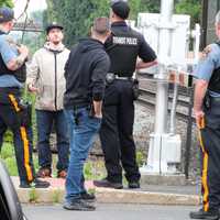 <p>Two trespassers on the railroad tracks in Fair Lawn stopped a train when it hit a backpack one of them was carrying, NJ TRANSIT said.</p>