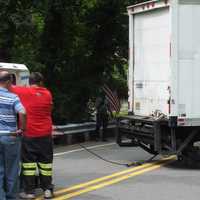 <p>To the rescue: City Wide Towing removes the struck truck on East Saddle River Road in Ho-Ho-Kus.</p>