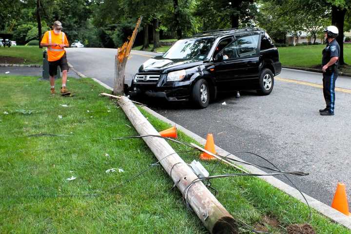 Driver Hospitalized After Older-Model SUV Rams, Splits Pole In Glen Rock