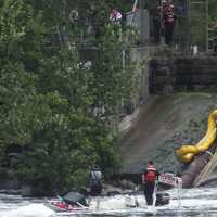 <p>The Clifton firefighters await their rescuers at the bottom of the Dundee Dam in the Passaic River.</p>