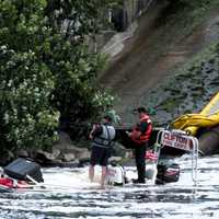 <p>The two Clifton firefighters stranded at the bottom of the falls at the Dundee Dam on the Passaic River await their rescuers.</p>