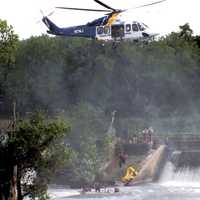 <p>A New Jersey State Police helicopter came to the rescue of the Clifton firefighters stranded in the Passaic River.</p>