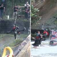 <p>Crowds of first responders and civilians watched as the NJSP rescued the two Clifton firefighters stranded at the bottom of the Dundee Dam in the Passaic River in Garfield.</p>