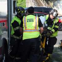 <p>His rescuers got the driver into an ambulance to be taken to the hospital following the crash off westbound Route 4 in Paramus on Wednesday, July 12.</p>