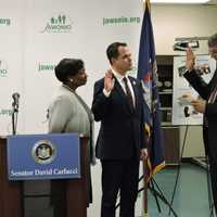 <p>Piperato swearing-in Sen. Carlucci at Jawonio in 2019.</p>