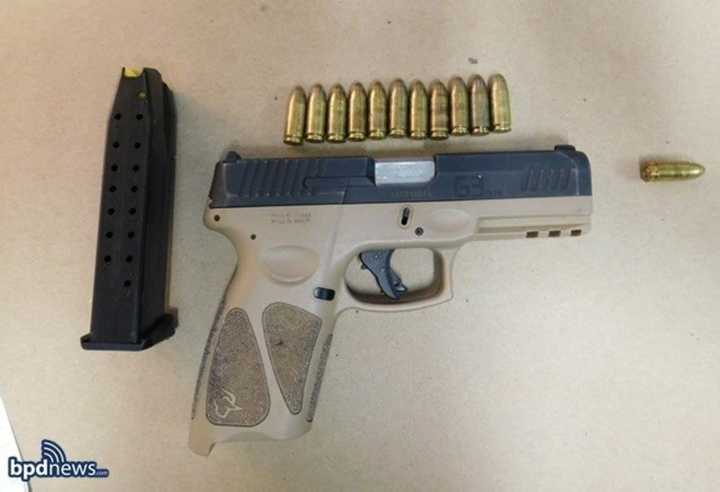 Boston police say officers confiscated this stolen, loaded gun from 19-year-old Corey Robinson on Sunday, July 31.