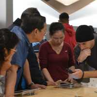 <p>Shoppers get a tutorial on the new iPhone 6S Plus at the Apple Store in Paramus.</p>