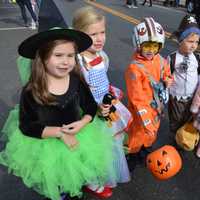 <p>Kids decked out in costume hit Main Street in Ridgefield for trick-or-treating.</p>