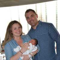 <p>Kate and John Procaccini with baby Mila Joy</p>