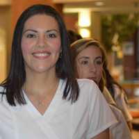 <p>Jessica Castano walks into the Pepsico Theatre to receive her nursing pin during a ceremony at Norwalk Community College Wednesday. </p>