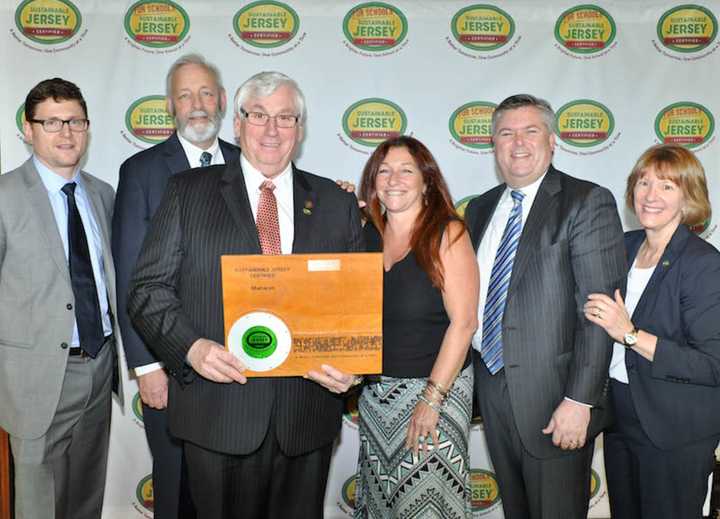 Mayor Bill Laforet, Karin LaGreca and Rich Wolf posed with Sustainable Jersey for Schools as the certification was presented.