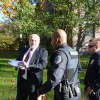 <p>New Castle Police confront Will Wedge as he is giving a press conference in front of the Chappaqua school district&#x27;s administrative building. Police responded on the district&#x27;s behalf.</p>