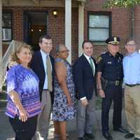 <p>Bridgeport Mayor Joe Ganim, fourth from left, and Police Chief Armando Perez, fifth from left, join city and state leaders in opening a police post at P.T. Barnum Apartments Thursday.</p>