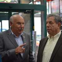 <p>Mount Kisco Mayor Michael Cindrich (left) talks with Mitch Modell, CEO of Modell&#x27;s Sporting Goods.</p>