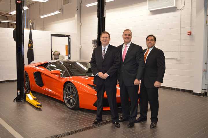 Paramus Police Chief Kenneth Ehrenberg, Mayor Richard LaBarbiera and Deputy Police Chief Robert Guidetti admire a Lamborghini Aventador LP 700-4 Roadster hard-top convertible.