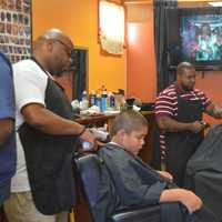 <p>Kids lined up for free haircuts just in time for the start of school at North East Barbershop in Bridgeport.</p>