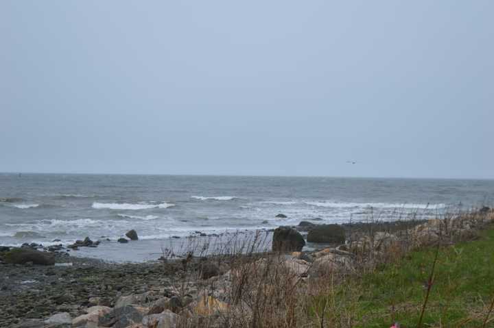 Whitecaps crashed on the shore at Stratford Point Friday.