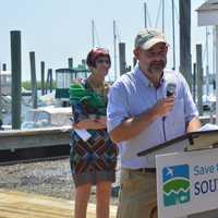 <p>New Long Island Soundkeeper Bill Lucey addresses the crowd as U.S. Rep. Rosa DeLauro, left, looks on.</p>