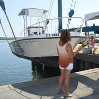 <p>Cheryl Backer, sister of the late Soundkeeper Terry Backer, christens Save the Sound&#x27;s new boat after her brother.</p>