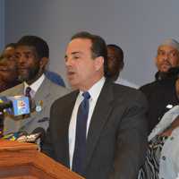 <p>Bridgeport Mayor Joe Ganim, second from left, addresses a press conference, while Police Chief AJ Perez, right, looks on.</p>