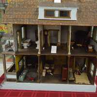 <p>An old-fashioned hand-made dollhouse.</p>