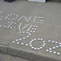 <p>Memorials lay at the site of a police officer-involved fatal shooting Tuesday night near the corner of Fairfield and Park avenues in Bridgeport.</p>