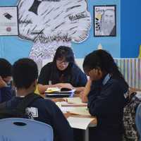 <p>Students at Great Oaks Charter School work in small groups to boost their reading and comprehension skills.</p>