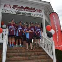 <p>State Rep. Brenda Kupchick applauds the Fairfield American Little League team.</p>