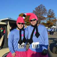 <p>Jim Perno of West Haven and Scott Bauer of East Haddam go the extra mile in dressing for the Vicki Soto 5K on Saturday in Stratford.</p>