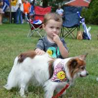 <p>Blake pets Pat the Angels Soccer Therapy Dog.</p>