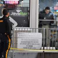 <p>A member of the Bergen County Sheriff&#x27;s Bureau of Criminal Identification collects evidence at the Sunoco station on Polifly Road in Hackensack following the Sunday, March 19 robbery.</p>