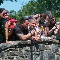 <p>Fans watch the team&#x27;s ritual from the bridge.</p>