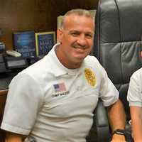 <p>Joey with Emerson Police Chief Michael Mazzeo</p>